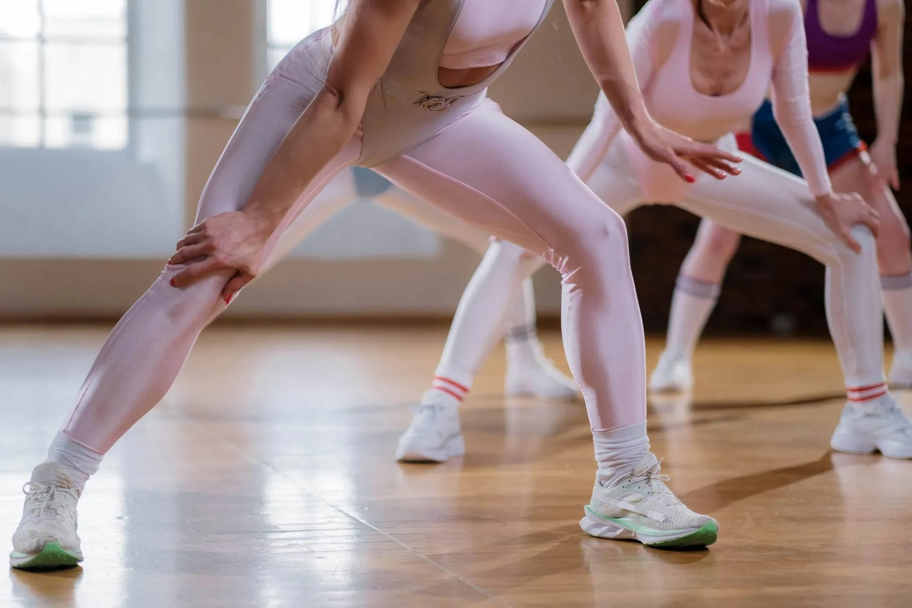 A group moving through a synchronized lateral lunge